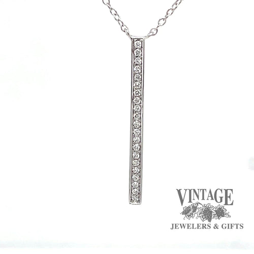 Revolving video of  14 karat white gold diamond bar pendant