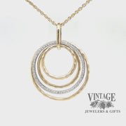 Multi circle 14k two tone gold and diamond pendant, revolving video