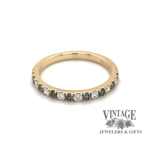 Revolving video of 14 karat yellow gold band with alternating round brilliant diamonds and emeralds