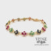 Revolving video of 14 karat yellow gold Ruby, emerald and sapphire floral cluster link bracelet