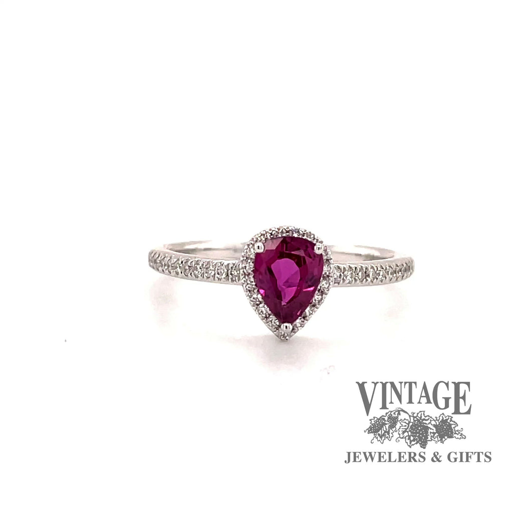 Revolving video of 14 karat white gold pear shape ruby ring with diamond halo