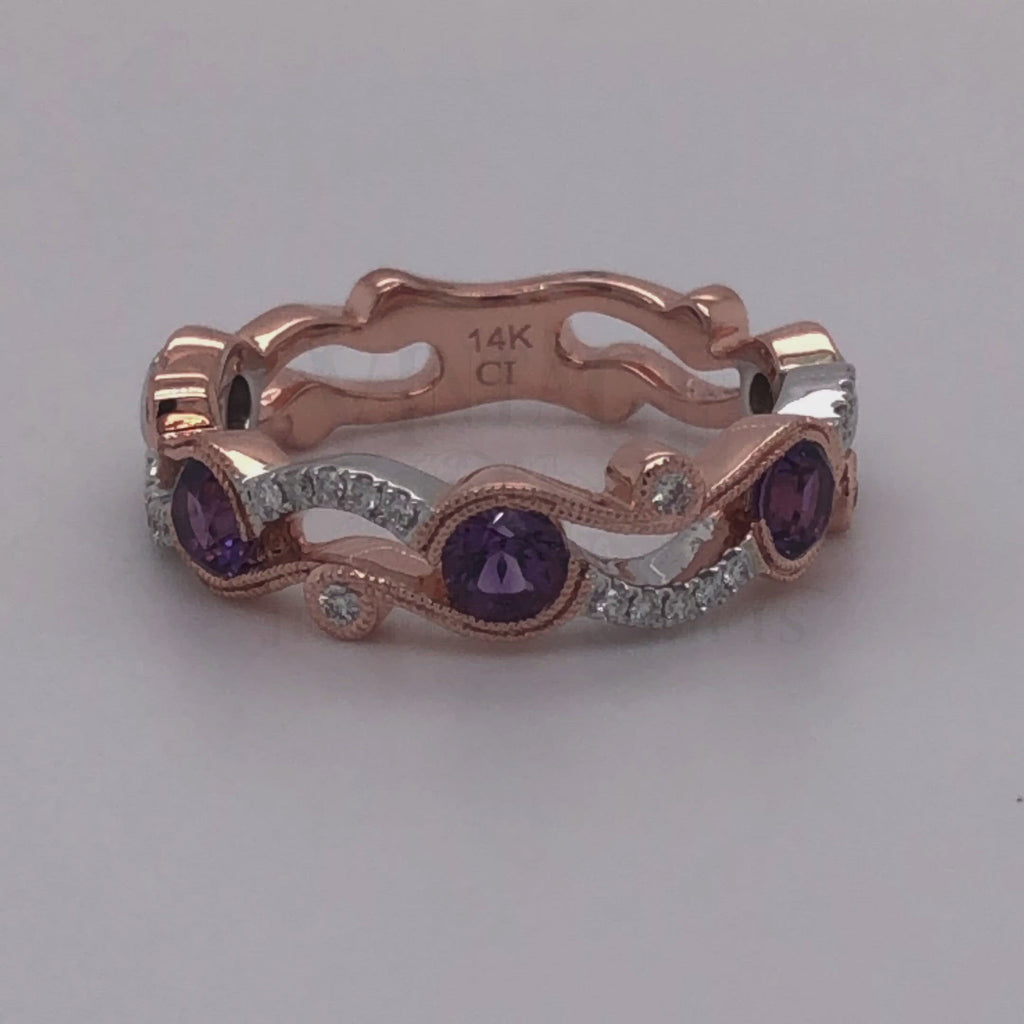 Revolving video of 14 karat rose and white gold diamond band with amethyst