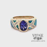 Revolving video of 14 karat yellow gold tanzanite, inlay opal and diamond ring