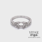 Revolving video of 14 karat white gold, vintage inspired, leaf design diamond semi ring mounting
