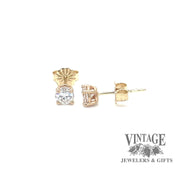 Revolving video of 14 karat yellow gold diamond stud earrings
