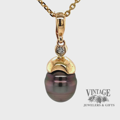 Revolving video of 14 karat yellow gold Tahitian pearl and diamond enhancer pendant