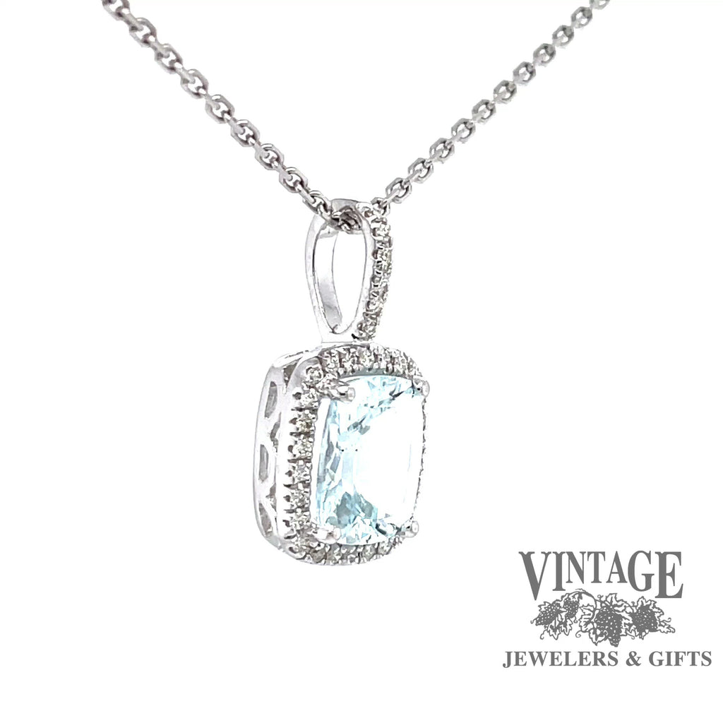 Revolving video of 14 karat white gold aquamarine with diamond halo pendant