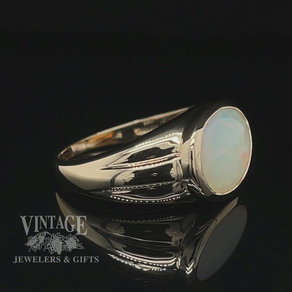 Revolving video of 14 karat yellow gold 3.8ct oval opal signet style ring