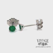 Revolving video of 14 karat white gold .20 carat total weight emerald martini stud earrings