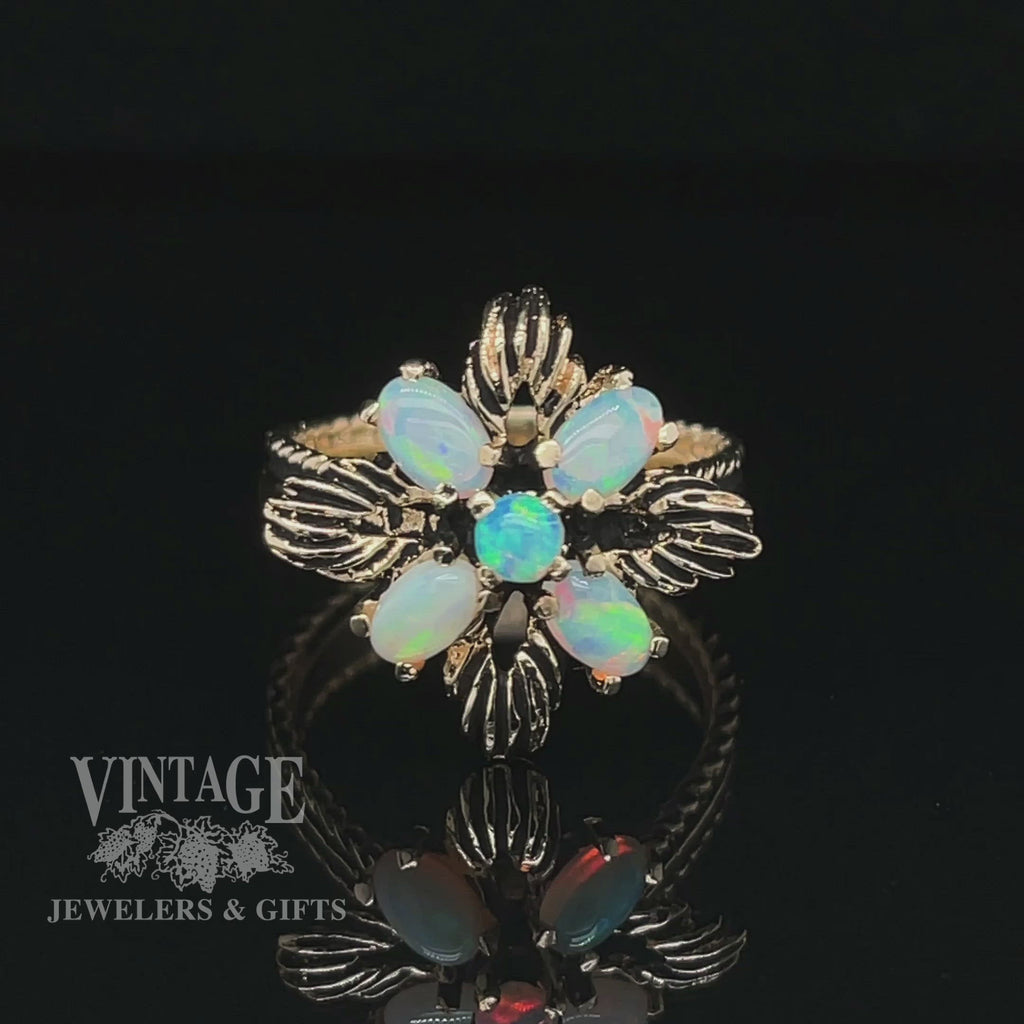 Revolving video of 14 karat yellow gold opal flower motif cluster ring