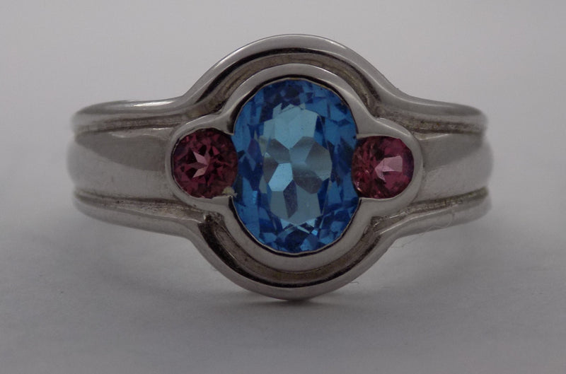 Oval blue topaz, pink tourmaline white gold ring