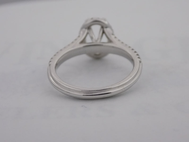 Halo diamond ring for oval 7 X 5 mm center stone