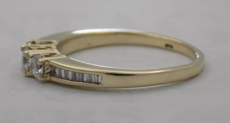 Three stone baguette shank diamond ring.