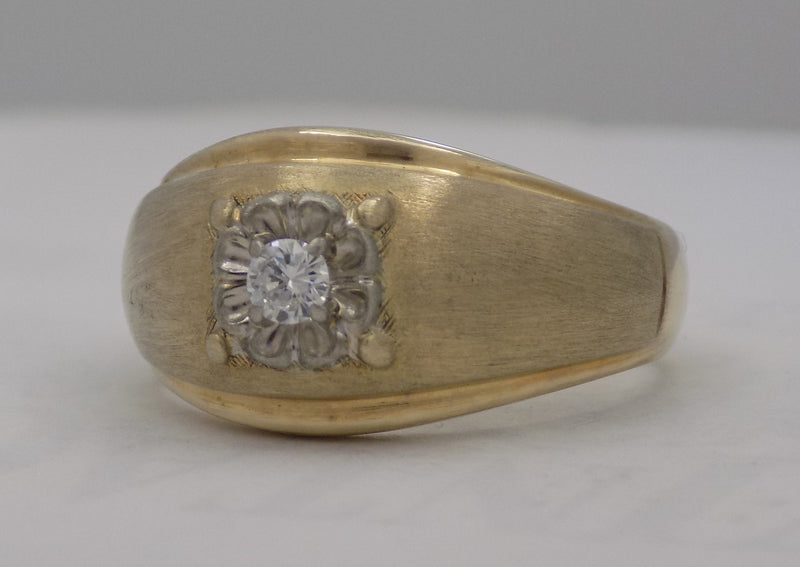 .12 carat two-tone diamond solitaire dome ring.