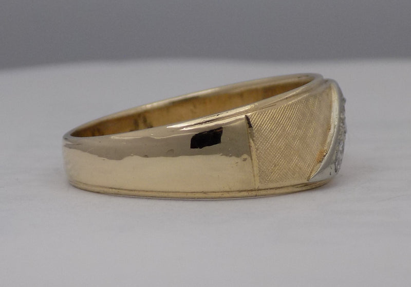 Yellow gold florentine finish diamond band