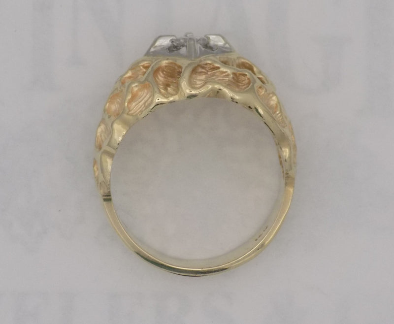 .18 carat yellow gold textured diamond ring.