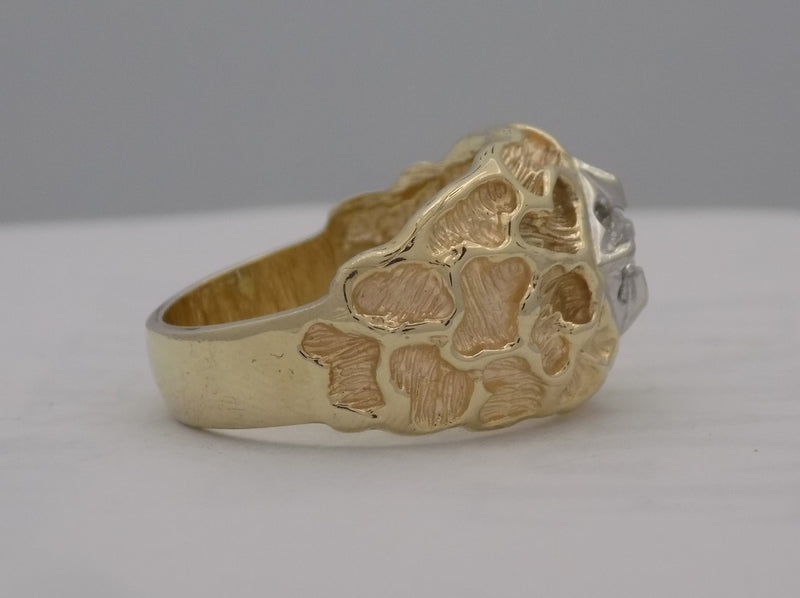 .18 carat yellow gold textured diamond ring.