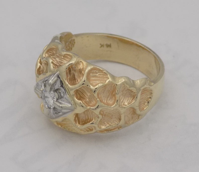 .18 carat yellow gold textured diamond ring.