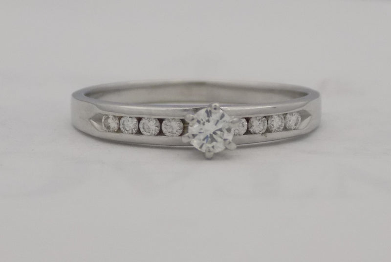 White gold diamond channel set band.