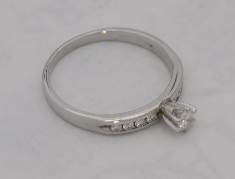 White gold diamond channel set band.