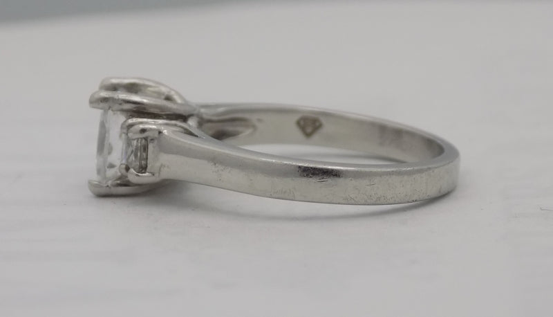 Platinum princess cut three stone ring.