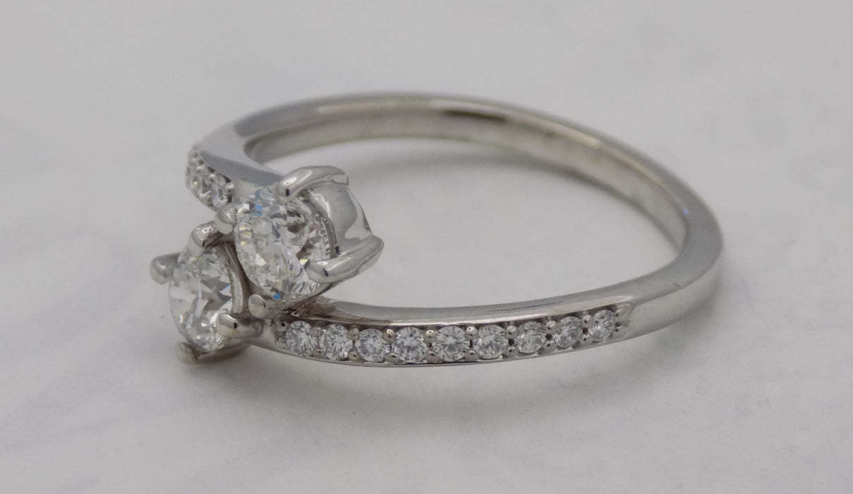 White gold diamond bypass ring with 2 round diamonds