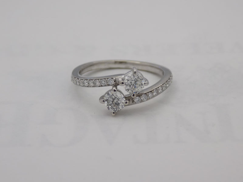 White gold diamond bypass ring with 2 round diamonds