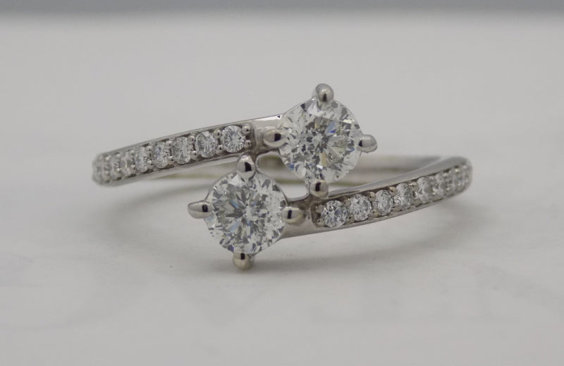 White gold diamond bypass ring with 2 round diamonds