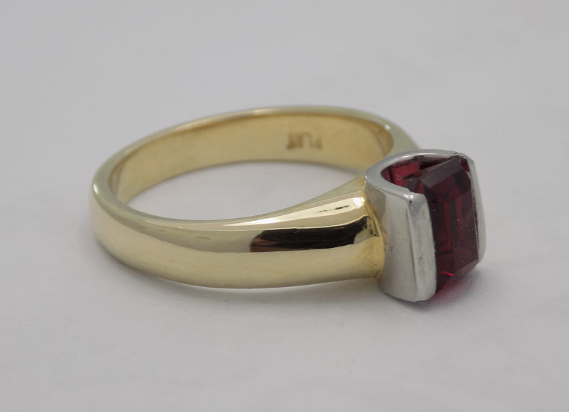 Yellow gold pink tourmaline set in platinum bar set design