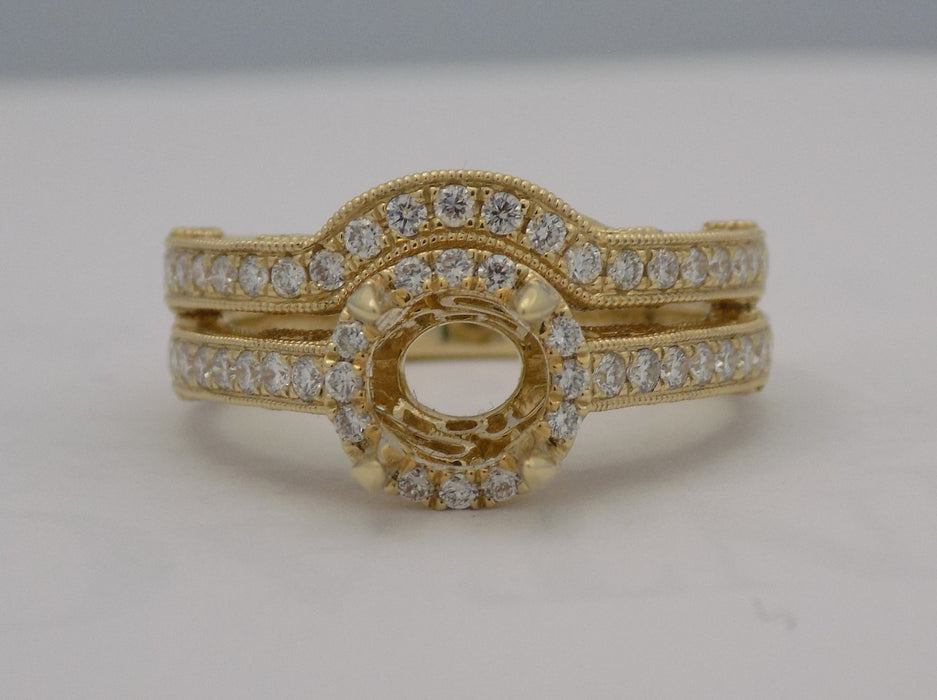 Yellow gold curved filigree diamond wedding ring set.