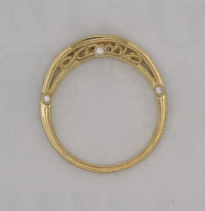 Yellow gold curved filigree diamond wedding ring set.