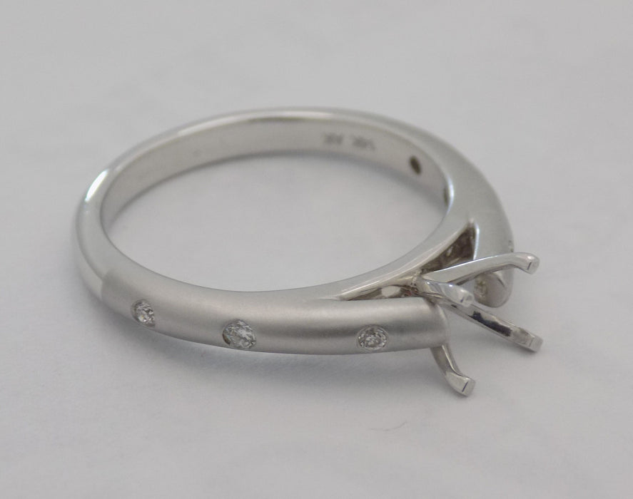 White gold flush set diamond semi-mount engagement ring for 1/2 carat round brilliant cut center stone