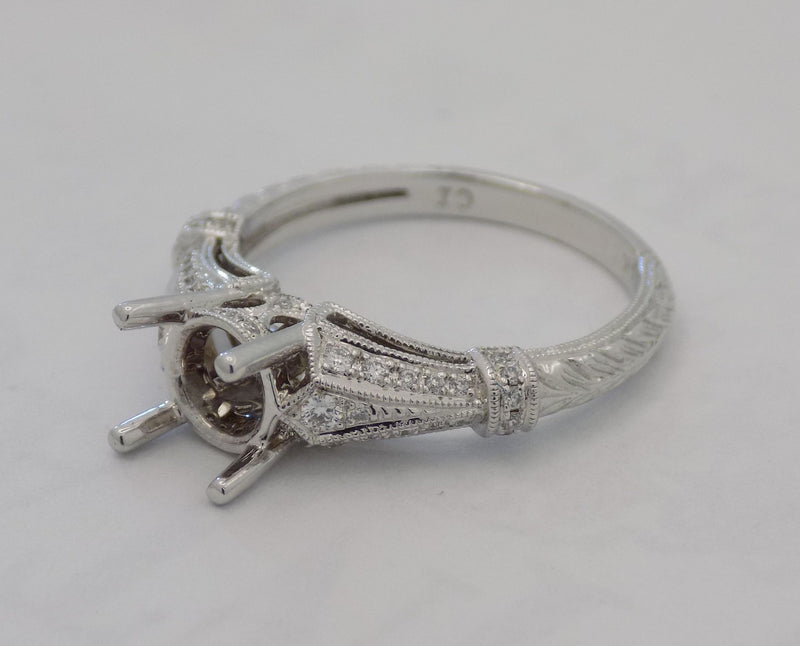 White gold diamond pave' semi-mount for 1.25 carat diamond center stone