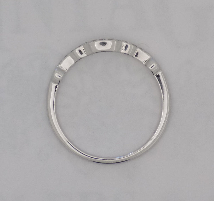 White gold curved pinpoint diamond band.