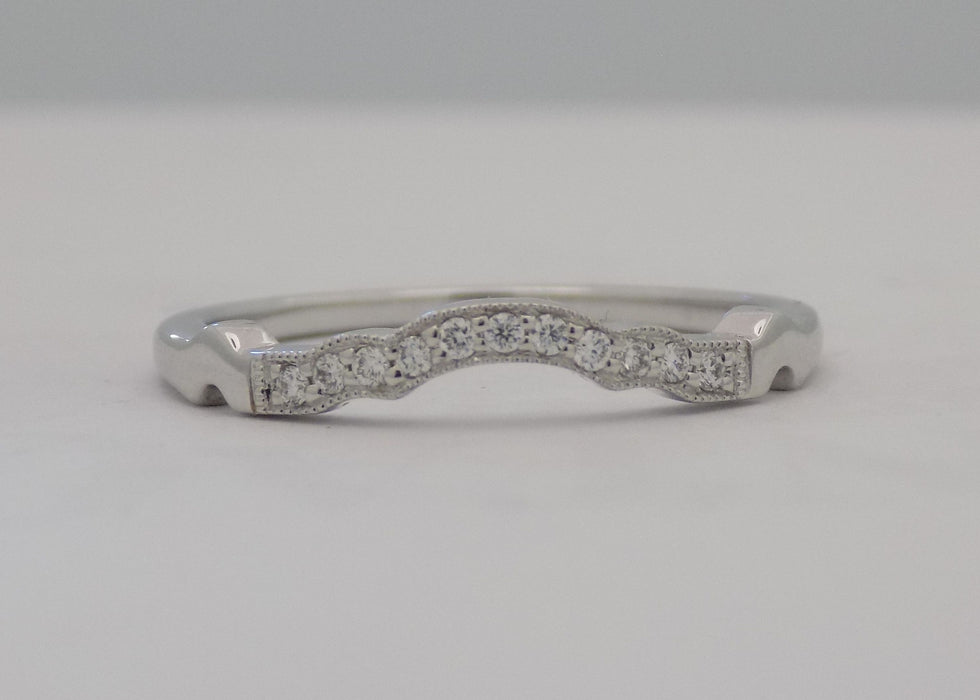 White gold curved pinpoint diamond band.