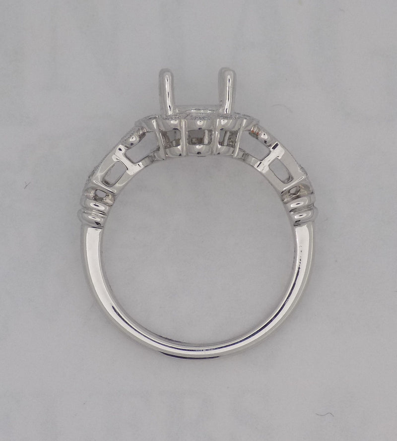 14 karaat white gold diamond semi mount for 1 carat oval diamond.