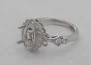 14 karat white gold diamond semi- mount for 1 carat oval diamond.