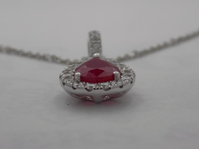 White gold pear shape ruby halo diamond pendant