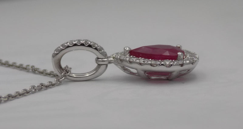 White gold pear shape ruby halo diamond pendant