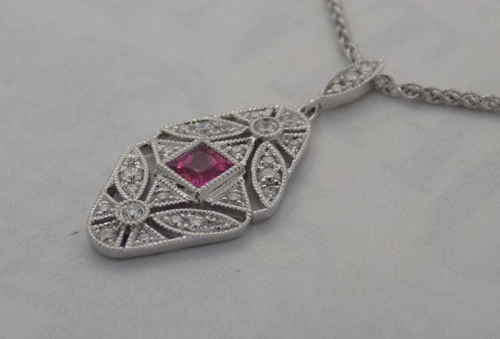 White gold filigree natural ruby pendant with diamond.