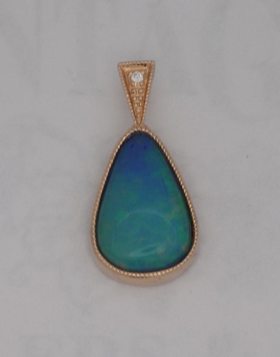 Rose gold bezel set pear-shape opal pendant