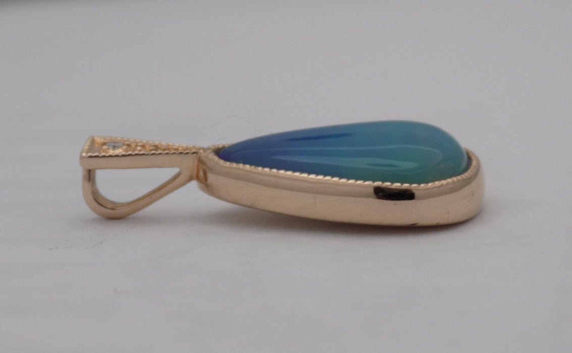Rose gold bezel set pear-shape opal pendant