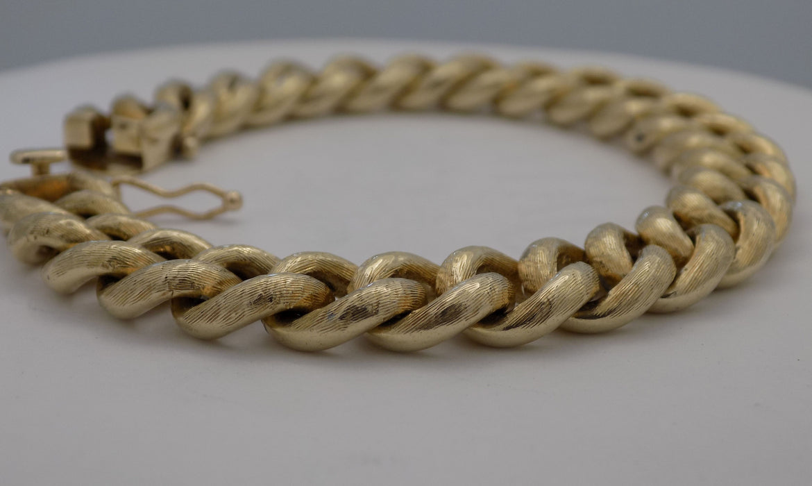 Close up,14 karat yellow gold estate heavy curb link bracelet