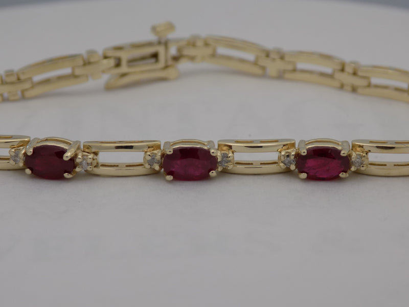 Natural ruby and diamond 14ky gold link bracelet