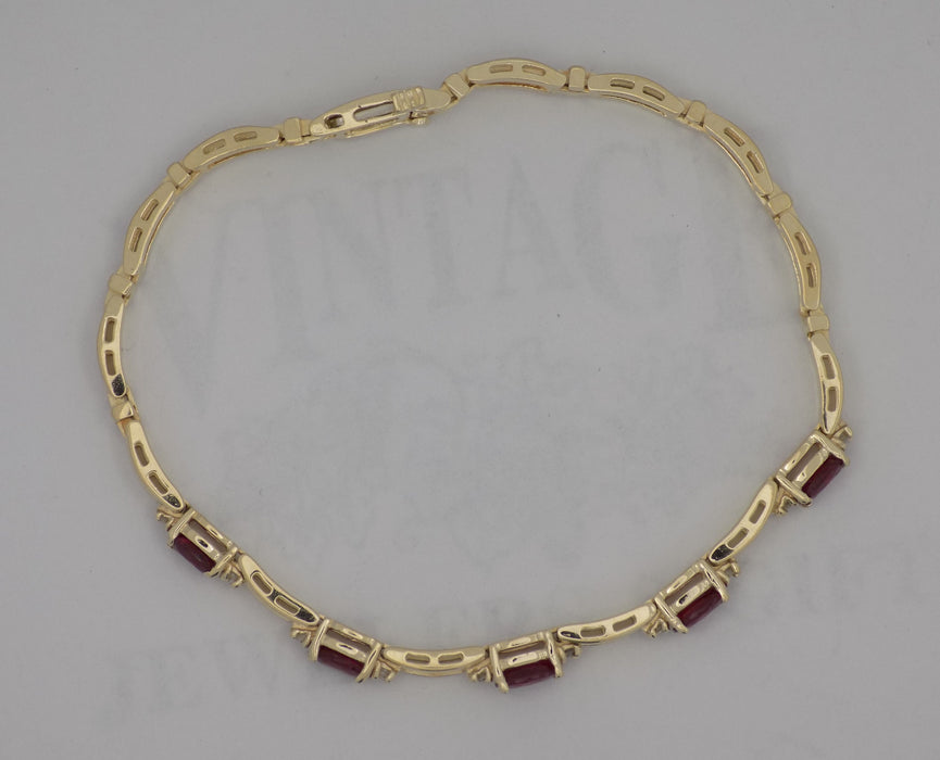 Natural ruby and diamond 14ky gold link bracelet