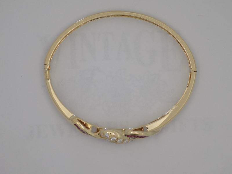 Yellow gold natural rubies and diamond bangle bracelet
