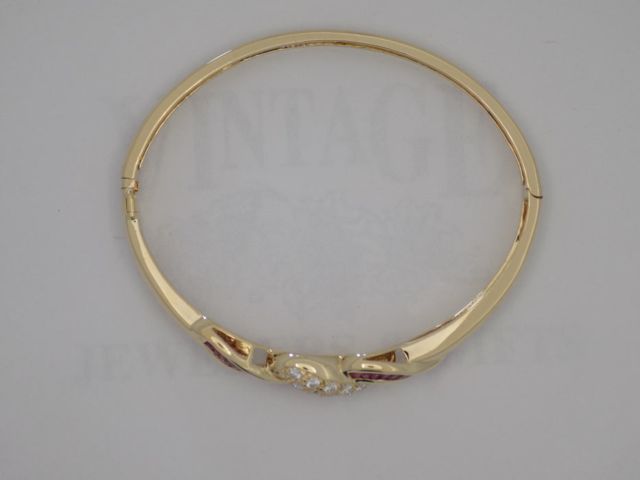 Yellow gold natural rubies and diamond bangle bracelet