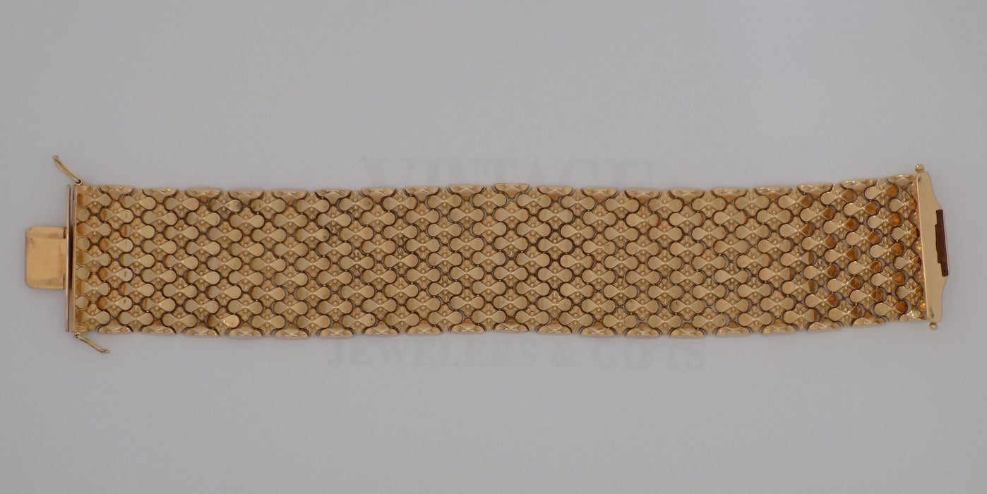 7.5” 18ky gold mesh link wide bracelet.