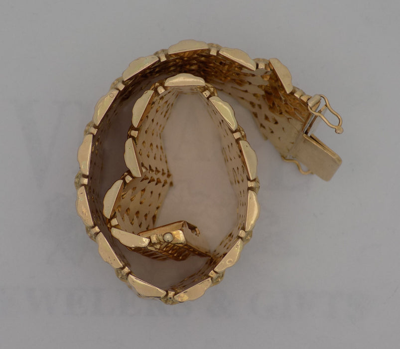 7.5” 18ky gold mesh link wide bracelet.