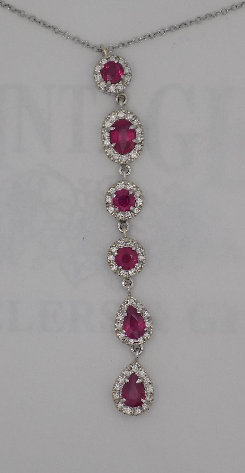 18 karat white gold natural ruby and  diamond halo cascading pendant